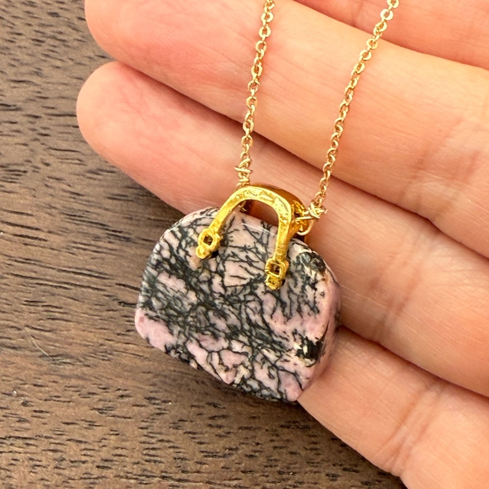 Carved pink and black rhodonite purse gold tone pendant necklace